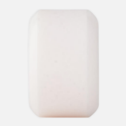 Rectangular white skateboard wheel on a light gray background