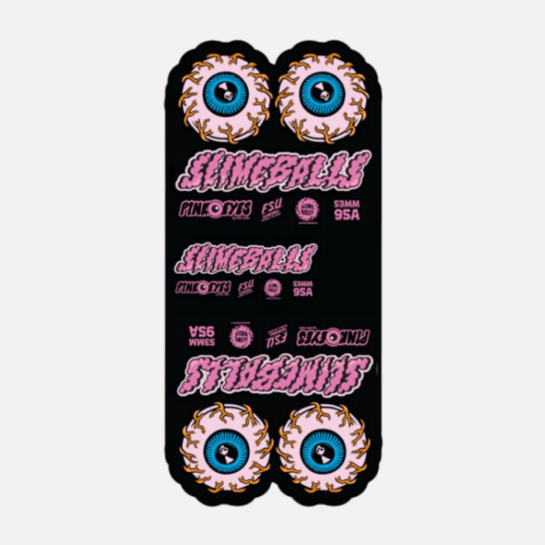 Black skateboard deck with colorful eye designs and 'Slime Balls' branding on a white background